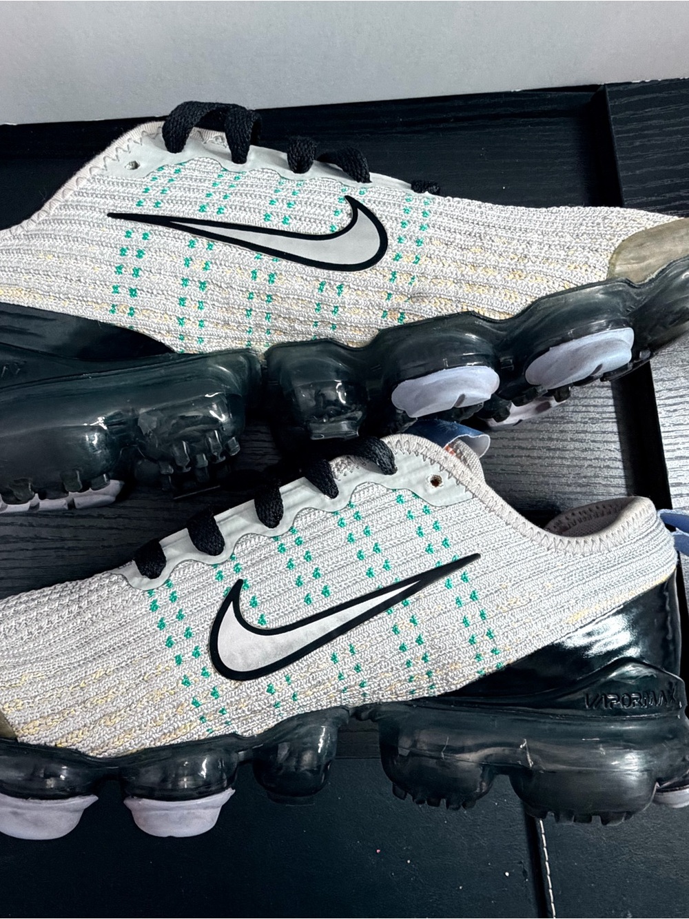Nike Men’s White Knit Sneakers with Black Accents and Teal Dots